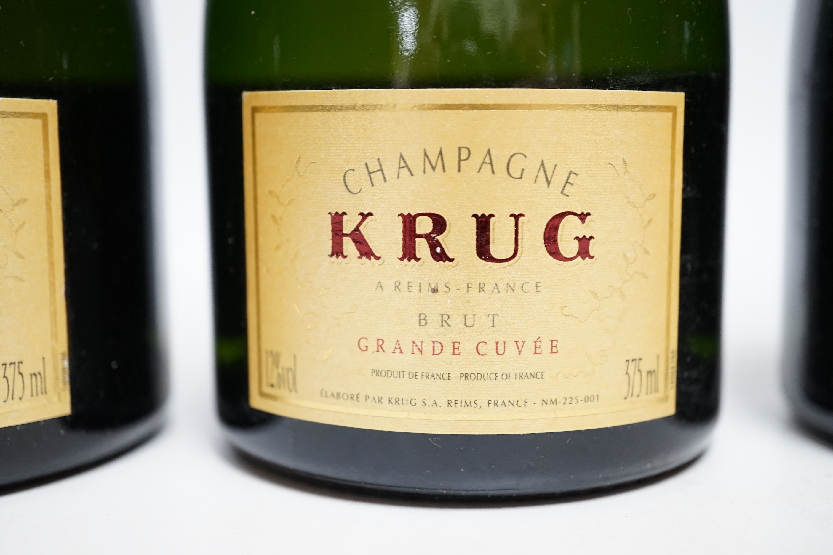 Three half bottles of Krug Grande Cuvee Champagne.